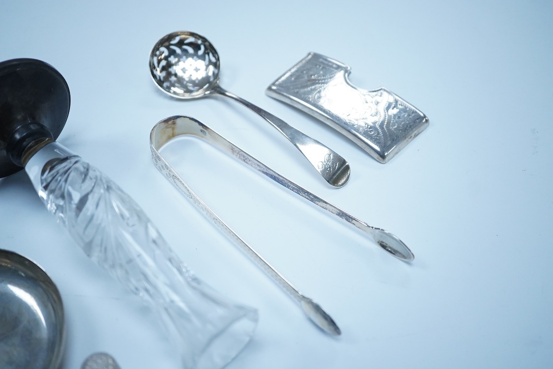 A collection of small silver to include a George V engraved concave card case, I. S. Greenberg & Co, Birmingham, 1912, 80mm, a cased late Victorian small bread fork, a modern mounted glass posy vase, an Irish nut dish, a